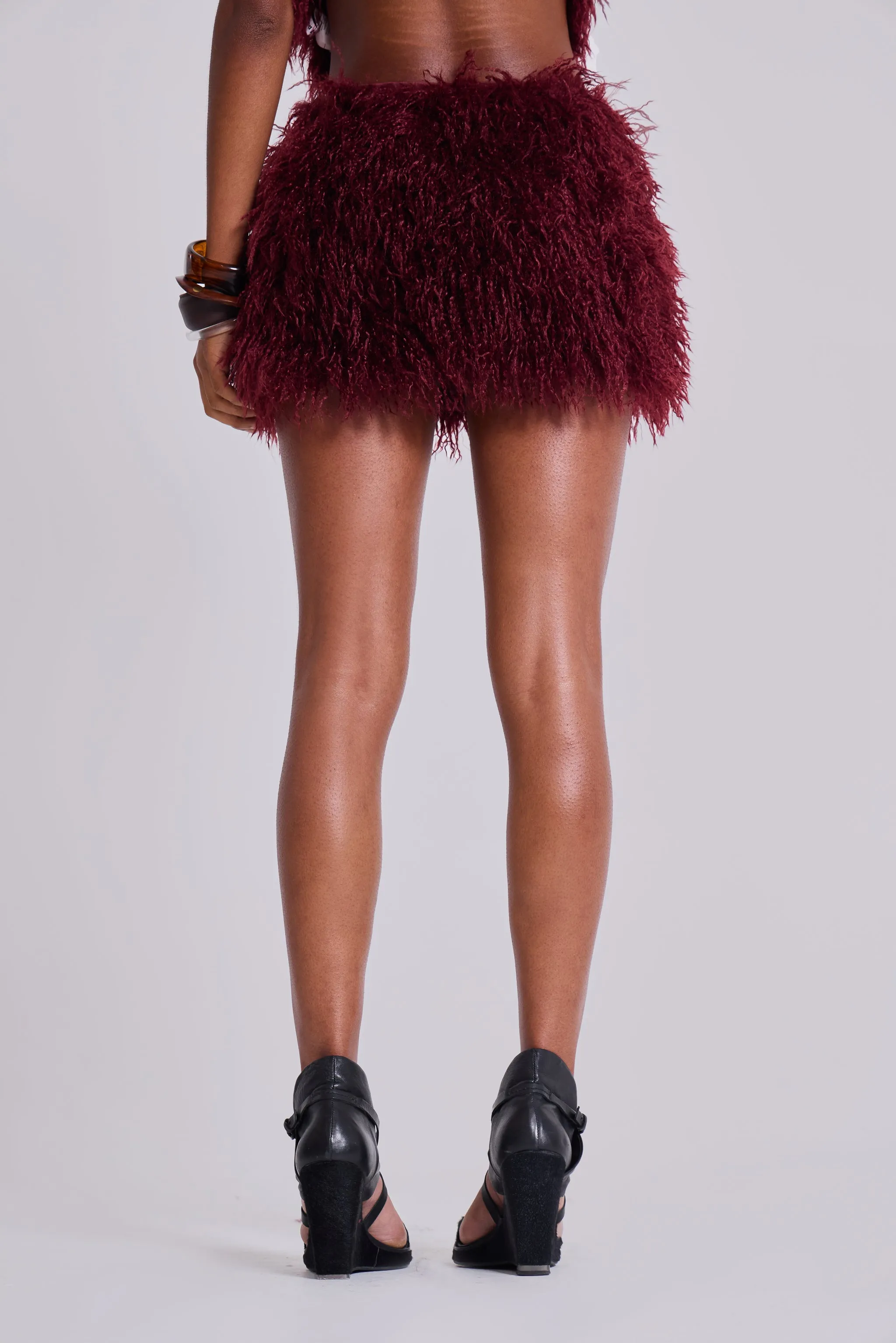 Haka Mongolian Faux Fur Mini Skirt in Wine