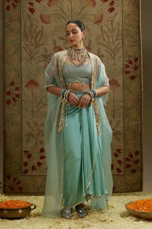 TEAL BLUE THREAD TASSLE CAPE PAIRED WITH METAL EMBELLISHED BUSTIER AND DRAPE SKIRT